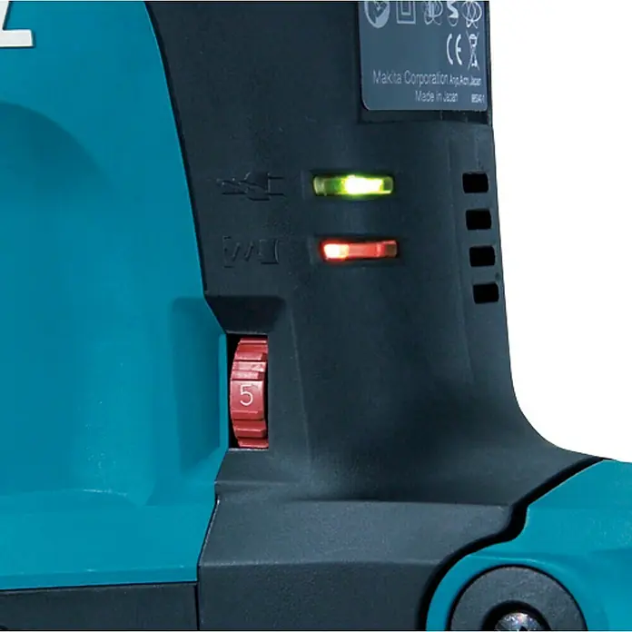 Makita Kombihammer HR3541FCX - 850 W, 5,7 J, SDS-Max-Aufnahme - Nahaufnahme eines türkis-schwarzen Makita-Elektrowerkzeugs mit rotem Drehregler auf „5“, grünem Licht und roter Warnleuchte.