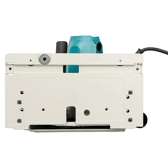 Makita Tauchsäge SP6000J1 mit Makpac und Führungsschiene - 1.300 W, 6.400 U/min - Unterseite einer Tauchsäge mit cremefarbener Grundplatte und türkisem Motorgehäuse.