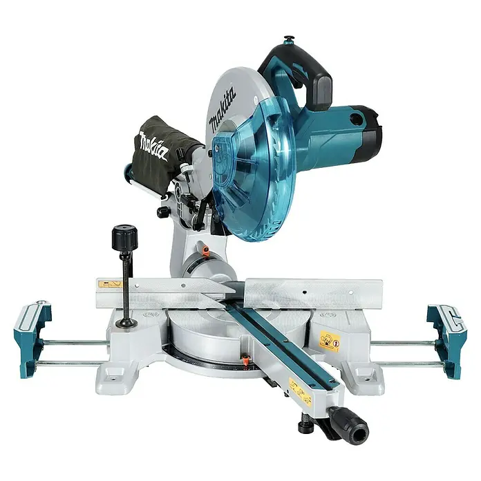 Makita Kapp- & Gehrungssäge LS1110F - 1.400 W, Durchmesser Sägeblatt: 260 mm, Leerlaufdrehzahl: 4.500 U/min - Makita Kapp- und Gehrungssäge mit grauem Gehäuse, türkisen Akzenten und blauem transparentem Schutz. Schwarzer Staubfangbeutel und Griff.