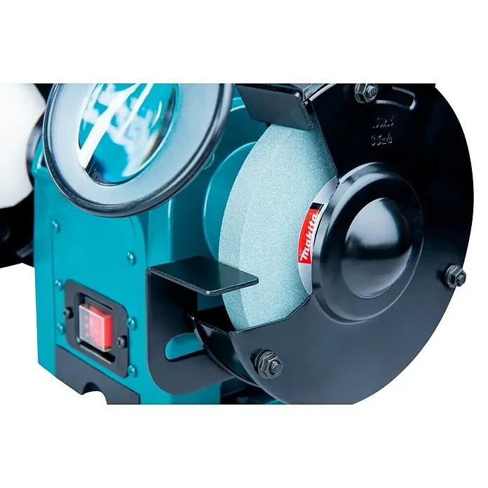 Makita Elektro-Doppelschleifer GB602 - 250 W, 2.850 U/min - Türkiser Makita-Schleifbock mit hellgrauer Schleifscheibe, schwarzem Schutz und rotem Schalter.