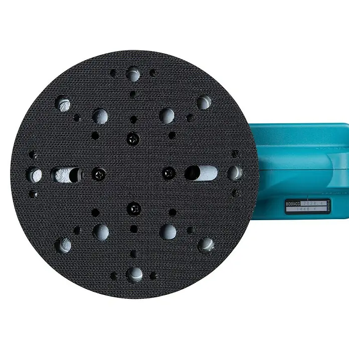 Makita XGT 40V max. Akku-Exzenterschleifer BO004CGZ - 40 V, Ohne Akku, Durchmesser Schleifteller: 150 mm - Rundes schwarzes Schleifpad mit Löchern und Schrauben, an einem türkisfarbenen Exzenterschleifer befestigt.