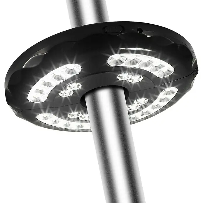 Uirax Luz LED para sombrillas - Diámetro: 20 cm, 200 lm, Blanco cálido - Luminaria LED negra con luces brillantes, sujeta a un poste plateado.