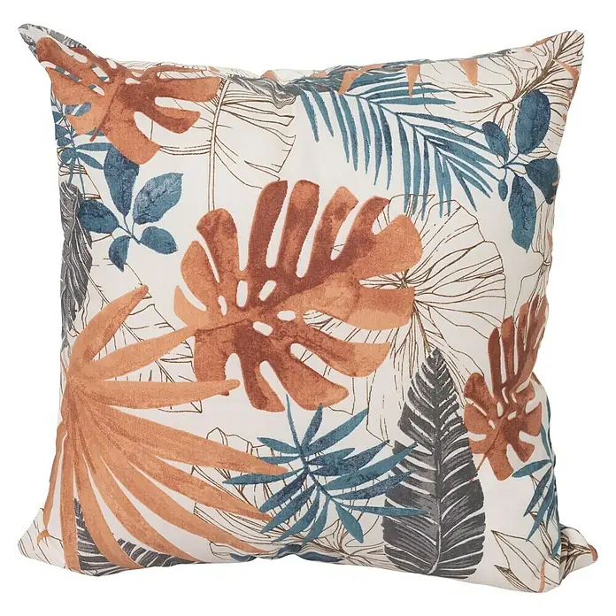 Cojín Deco Palmito - 50 x 50 cm, Plástico, Multicolor - Cojín cuadrado decorativo con estampado de hojas tropicales en marrón, azul y gris sobre fondo blanco.