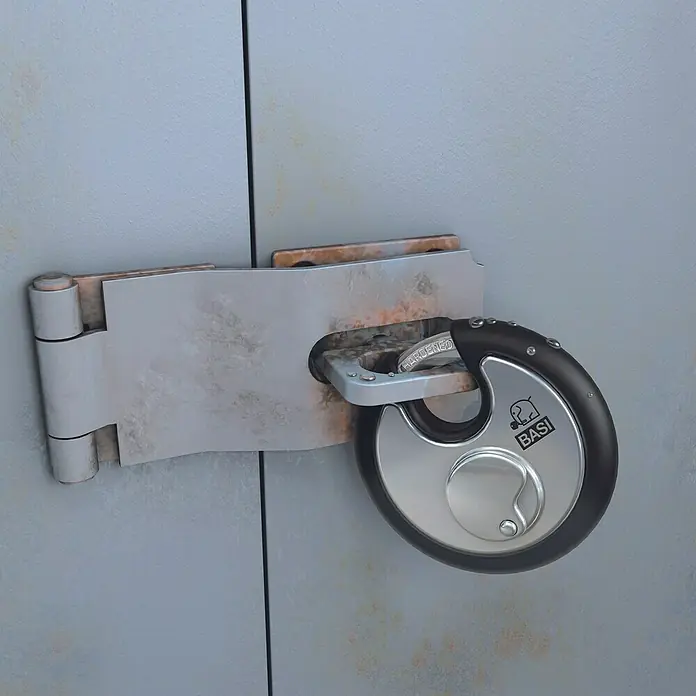 Basi Diskusschloss RVS 610W - B x H: 70 x 70 mm, Bügelstärke: 9,5 mm, Material Bügel: Gehärteter Spezialstahl - Rundes schwarz-silbernes Vorhängeschloss sichert verrostete Metallüberfalle und Scharnier an grauer Tür.