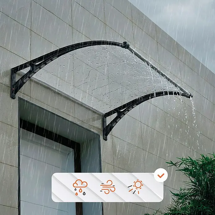 SmartSun Marquesina para puerta Easy LED - 120 x 97 x 31,6 cm, Antracita - Toldo transparente con marco negro sobre una puerta en una pared, protege de la lluvia. Iconos del tiempo confirman resistencia a sol, viento y lluvia.