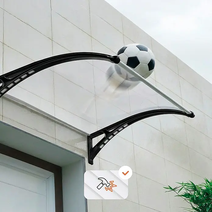 SmartSun Marquesina para puerta Easy LED - 120 x 97 x 31,6 cm, Antracita - Toldo transparente con soportes negros, mostrando un balón de fútbol rebotando para demostrar resistencia a impactos. Un icono de martillo confirma durabilidad.