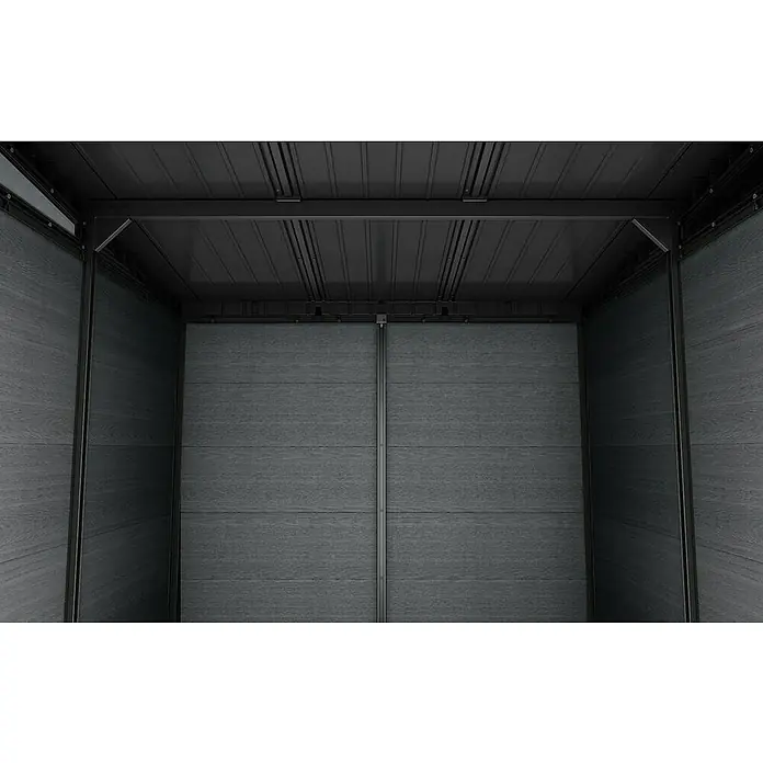 Keter Caseta de jardín Cortina 7x9 - Medidas ext. (An x Pr): 279 x 218 cm, Plástico, Gris, 6,08 m² - Interior de cobertizo gris oscuro con veta de madera, techo acanalado y paneles de puerta centrales.