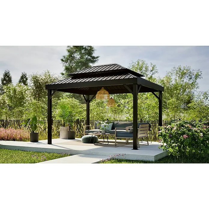 Sojag Standard-Pavillon London 1014 - L x B x H: 424,3 x 299,3 x 310 cm, Aluminium, Schwarz - Schwarzer Metall-Gartenpavillon mit Stufen-Dach, schattenspendend über Gartenmöbeln auf einer Terrasse mit viel Grün.