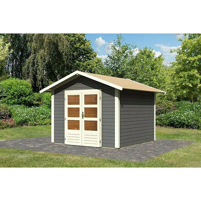 Karibu Gartenhaus Talkau 6 - Außenmaß inkl. Dachüberstand (B x T): 300 x 304 cm, Holz, Grau - Ein graues Gartenhaus mit Doppeltür und hellem Dach auf einer gepflasterten Fläche. Das Gartenhaus ist von Grün umgeben.