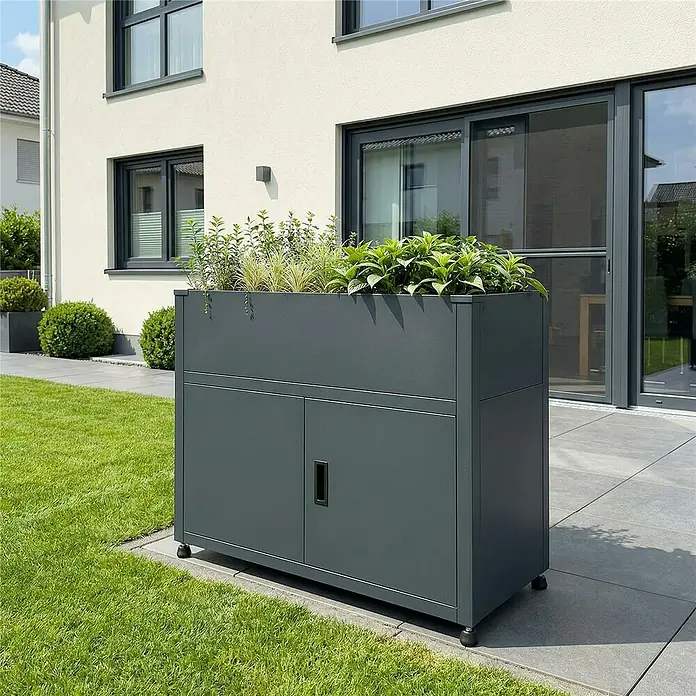 Metzler Hochbeet mit Stauraum - 100 x 50 x 90 cm, Stahl, Anthrazit - Dunkelgraues Outdoor-Pflanzgefäß mit integriertem Lagerschrank, oben bepflanzt mit verschiedenen grünen Pflanzen.