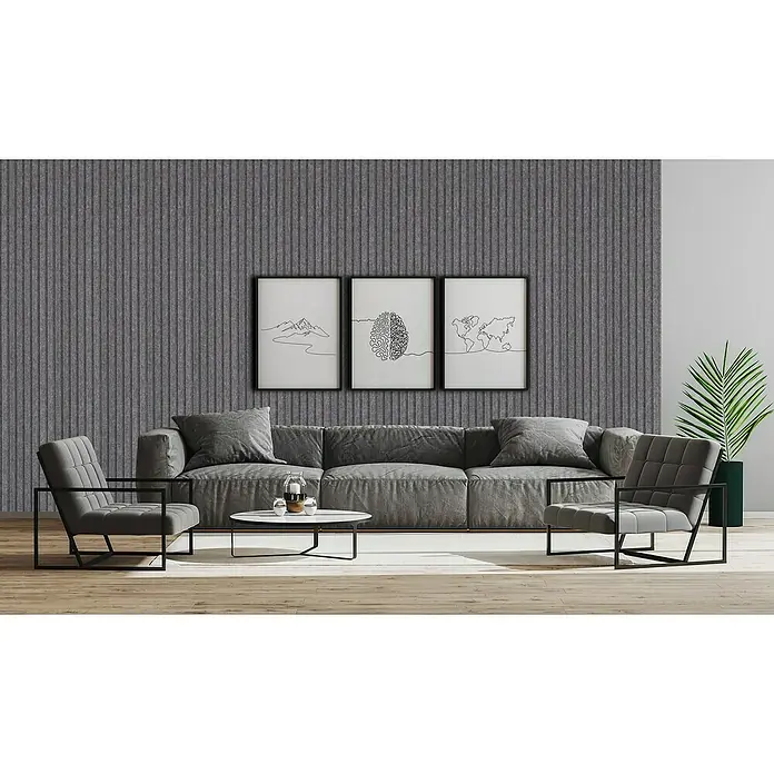 Lautloz living Akustikpaneel Coverz - Anthrazit, 20 x 240 cm, Textil - Ein modernes Wohnzimmer mit einem großen grauen Ecksofa, zwei grauen Sesseln mit schwarzen Gestellen und einem weißen ovalen Couchtisch.