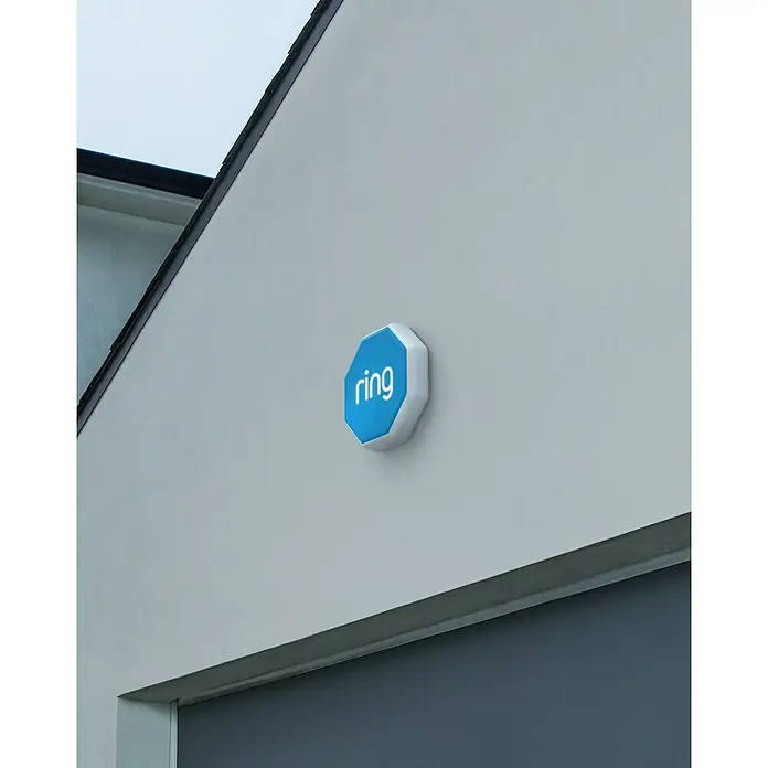 Ring Alarmsirene Outdoor - 100 dB, Batteriebetrieben - Oktogonale blau-weiße Ring Alarmsirene mit leuchtendem Logo.