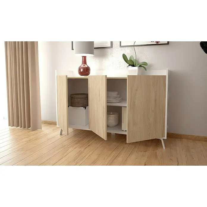 Meka Block Conjunto mueble de salón K-50 - 2 pzs., Blanco Poro/Roble Aurora - Aparador blanco y de madera clara con tres compartimentos abiertos, con platos y cajas de almacenamiento. Encima hay una lámpara roja y una planta.