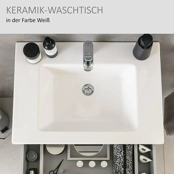 Camargue Star Einbauwaschbecken - 70 x 50 cm, Weiß - Weißes Keramik-Waschbecken mit Armatur, Toilettenartikeln und offener, organisierter Schublade darunter.