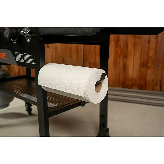 Blackstone Plancha Grill - Superficie de la parrilla (An x Pr): 91 x 55 cm, Negro, Número de quemadores: 4 ud. - Soporte de metal negro para papel de cocina con rollo blanco, integrado en un carrito de parrilla exterior negro.