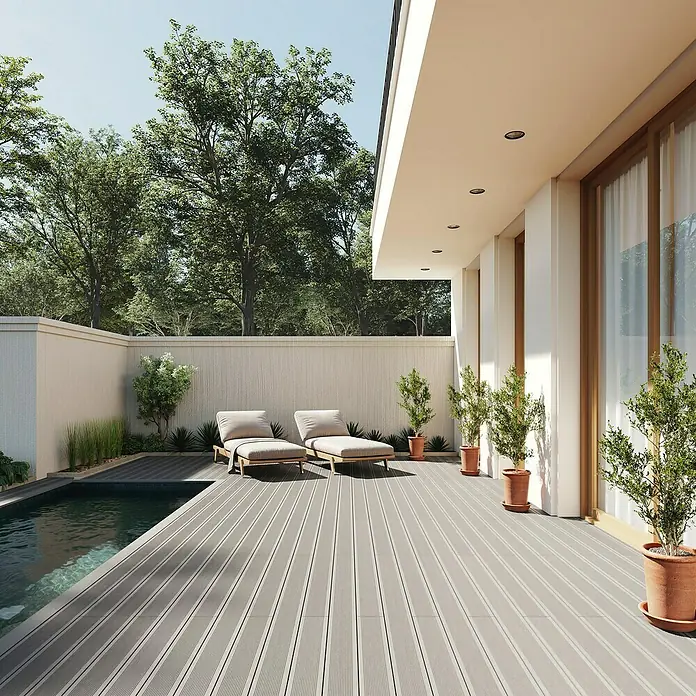 Dioco Tablón para terraza WPC Durafloor - L x An x Es: 220 x 14 x 2,3 cm, Arena/Gris, 1 ud. - Tarima compuesta gris instalada alrededor de una piscina moderna con tumbonas.