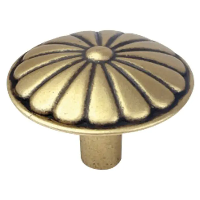 Nesu Pomo para muebles 213818 - Ø x Al: 35 x 26 mm, Acero - Primer plano de un pomo de mueble dorado decorativo con un diseño en forma de pétalo.