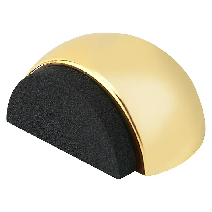 Inofix Tope de puerta 2029 - Plástico, Oro - Primer plano de un tope de puerta semicircular de espuma dorada y negra sobre un fondo negro.