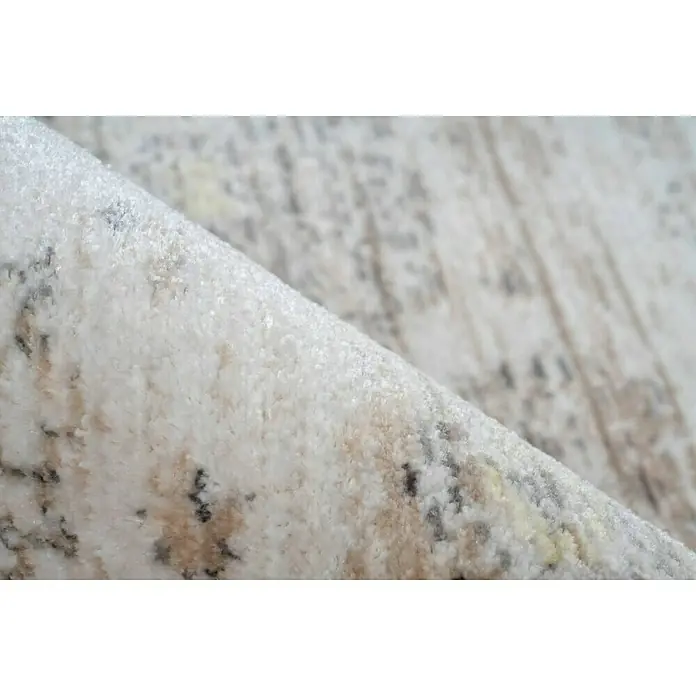Kayoom Kurzflorteppich Baroque 1000 - Beige, 230 x 160 cm, 100 % Polyester - Nahaufnahme eines hellen Teppichs mit gemusterten Details, der Textur und Design hervorhebt.