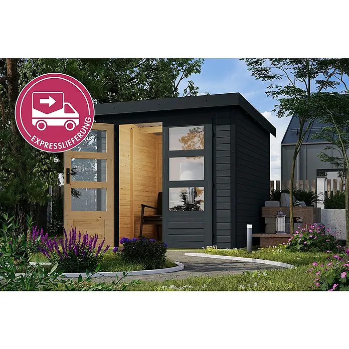 Karibu Gerätehaus Locknell Express - Außenmaß inkl. Dachüberstand (B x T): 228,5 x 235 cm, Holz, Anthrazit - Modernes dunkelgraues Gartenhaus mit Flachdach, hellem Holzinterieur und offener Glastür, in einem üppigen Garten.