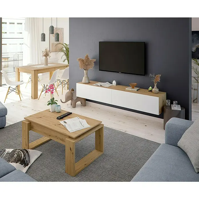 Mueble para TV Kaway - L x An x Al: 34,5 x 180 x 28 cm, Roble Nodi/Blanco Artik - Salón moderno con mesa de centro de madera clara, mueble TV blanco y de madera, y sofá azul sobre una alfombra gris.