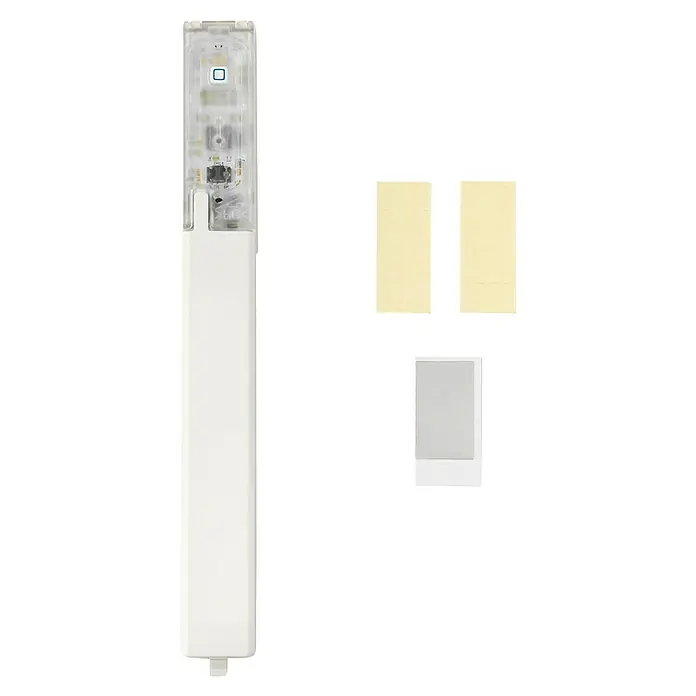 Homematic IP Sensor de ventana y puerta HmIP-SWDO-I - Blanco, 19 x 166,5 x 12,5 mm, Funciona con pilas - Sensor inteligente rectangular blanco con parte superior transparente que muestra electrónica, LED azul y botón, con soportes adhesivos amarillos y grises.