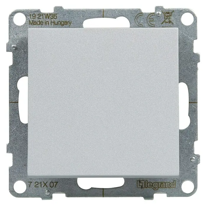 Legrand Suno Cruzamiento - Aluminio, Montaje en superficie, 10 A - Placa de cubierta de interruptor gris claro de plástico sobre un marco de montaje metálico.