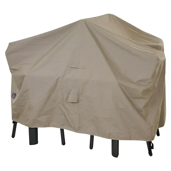 Siena Garden Sitzgruppen-Schutzhülle PLUS - Passend für: Sitzgruppen inkl. 6 Stühlen, 200 x 150 x 85 cm, Polyester, TPU laminiert, Beige - Hellbeige Stoff-Outdoor-Abdeckung, die einen Gegenstand mit schwarzen Beinen schützt.