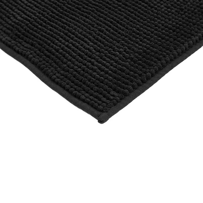 Badteppich Zottel - 50 x 80 cm, Schwarz, 100% Polyester - Ecke einer schwarzen texturierten Schlingen-Badematte.