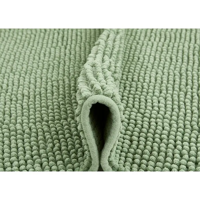 Badteppich Zottel - 50 x 80 cm, Salbei, 100% Polyester - Hellgrüne, plüschige Badematte mit tiefer Noppenstruktur, teilweise aufgerollt zur Ansicht der Dicke.
