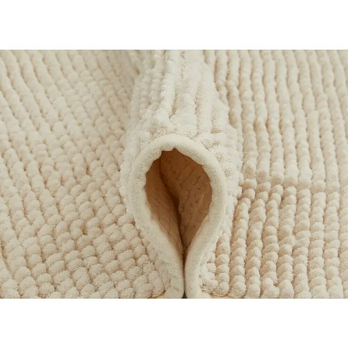 Badteppich Zottel - 50 x 80 cm, Creme, 100% Polyester - Weicher cremefarbener Textilstoff mit erhabener Noppenstruktur, gefaltet.