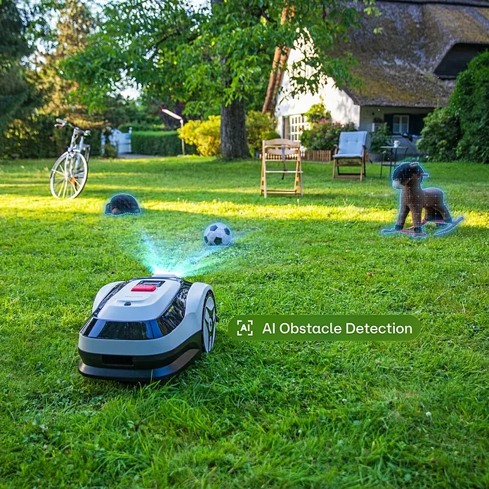 RoboUp Mähroboter Raccoon 2 SE - 600 m², Schnittbreite: 20 cm, Kamera-gestützte Navigation - Grau-schwarzer Mähroboter erkennt Hindernisse mit KI in einem Garten.