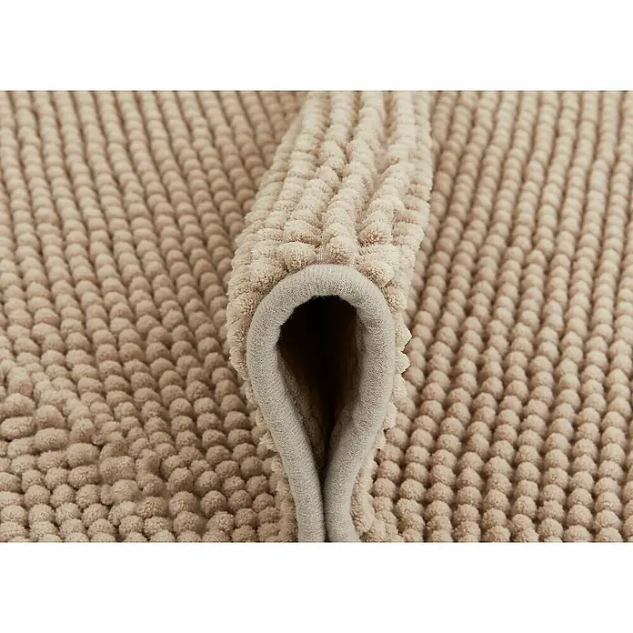 Badteppich Zottel - 50 x 80 cm, Sand, 100% Polyester - Teilweise gerollte beigefarbene Badematte mit weicher, noppiger Textur.