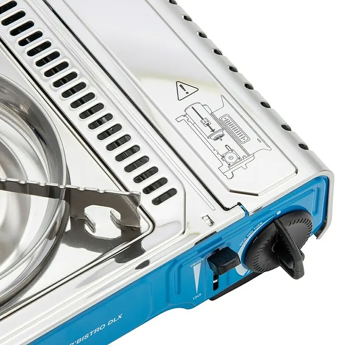 Campingaz Gaskocher Camp Bistro DLX - L x B x H: 285 x 370 x 125 mm, Leistung: 2.120 W, Ohne Stopgaz-System - Silberner tragbarer Gaskocher mit blauer Basis, Metallrosten, schwarzem Bedienknopf und Sicherheitsschalter.