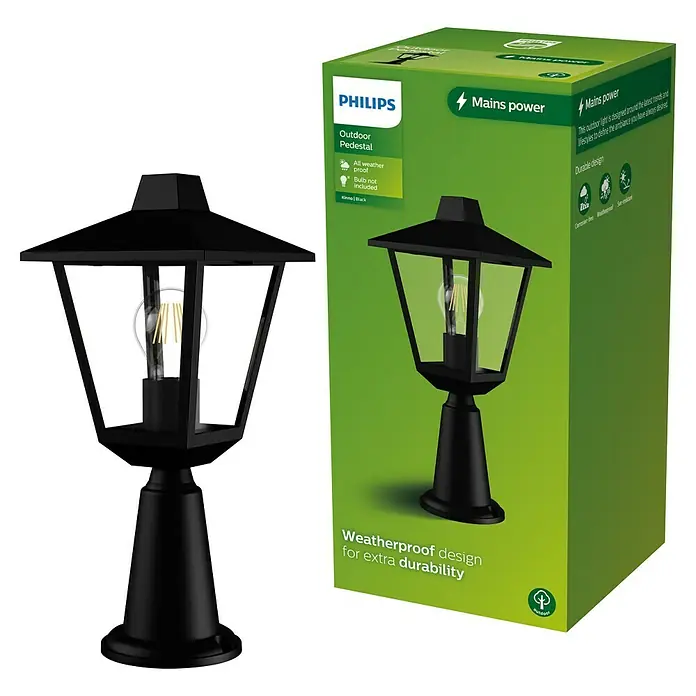 Philips Sobremuro exterior Kinno - 25 W, Color del marco: Negro, 17 x 17 x 39 cm, Sin bombillas - Una lámpara de pedestal exterior negra con bombilla visible, junto a su embalaje verde de Philips.