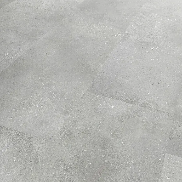 Revêt Wandpaneel SPC Wall - 600 x 300 mm, Beton Grau - Grauer, gesprenkelter Fliesenboden in Betonoptik.