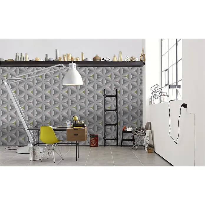 A.S. Création Vliestapete Move Your Wall - Blau/Grau/Rosa, Grafisch, 10,05 x 0,53 m - Heller Arbeitsplatz mit Schreibtisch, gelbem Stuhl und auffälliger 3D-Wand, die dem Raum eine moderne Note verleiht.