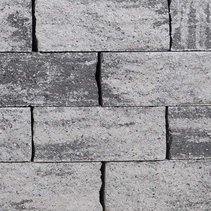 EHL EIBA Mauerstein - 30 x 15 x 12 cm, Grau-Anthrazit, Beton - Wand aus texturierten grauen und schwarzen Aggregatsteinblöcken.