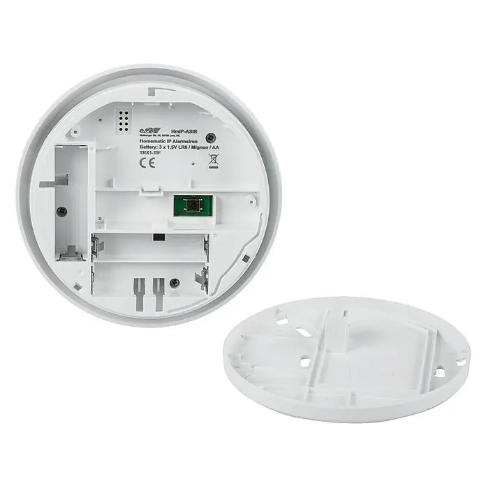 Homematic IP Alarmsirene HmIP-ASIR-2 - Batteriebetrieben, Alarmsignal: 90 dB, Ø x H: 12,4 x 4,5 cm - Innenansicht einer Homematic IP Alarmsirene, die das Batteriefach und die Elektronik zeigt.