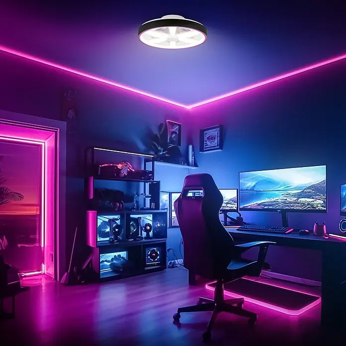 Briloner Ventilador de techo Air - Negro, 48 cm, 48,5 W, RGB - Lámpara de techo redonda blanca y negra con diseño interior en forma de estrella, iluminando una sala de juegos.