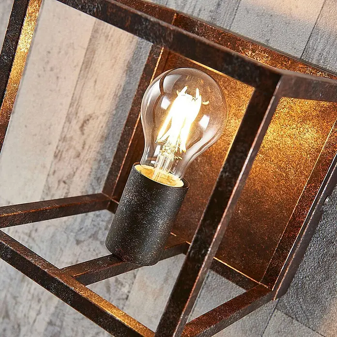 Lindby Wandleuchte Emin - braun / rost, braun / rost, E27 - Beleuchtete Wandleuchte mit dunklem Bronzemetallkäfig und sichtbarer LED-Glühbirne.