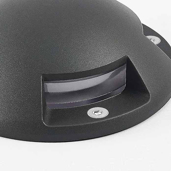 Lindby LED-Gartenstrahler Huban - 3.000 K - Dunkelgraue, körnig strukturierte Außenleuchte mit gekrümmter transluzenter Linse und Sechskantschrauben zur Bodeneinbau.