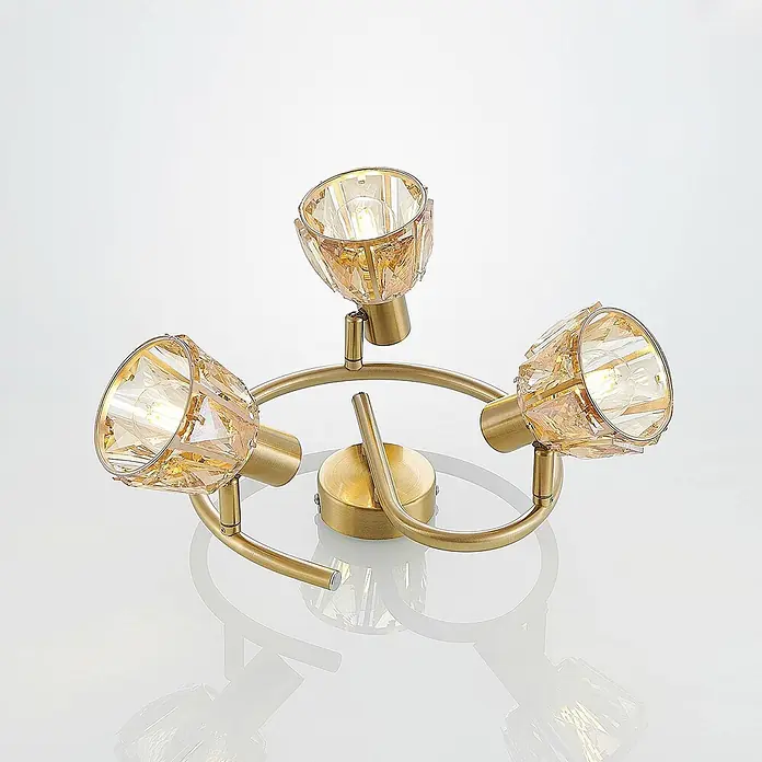Lindby Deckenleuchte Kosta - messing / gold, E14 - Goldener 3-flammiger Deckenstrahler mit facettierten bernsteinfarbenen Glasschirmen.