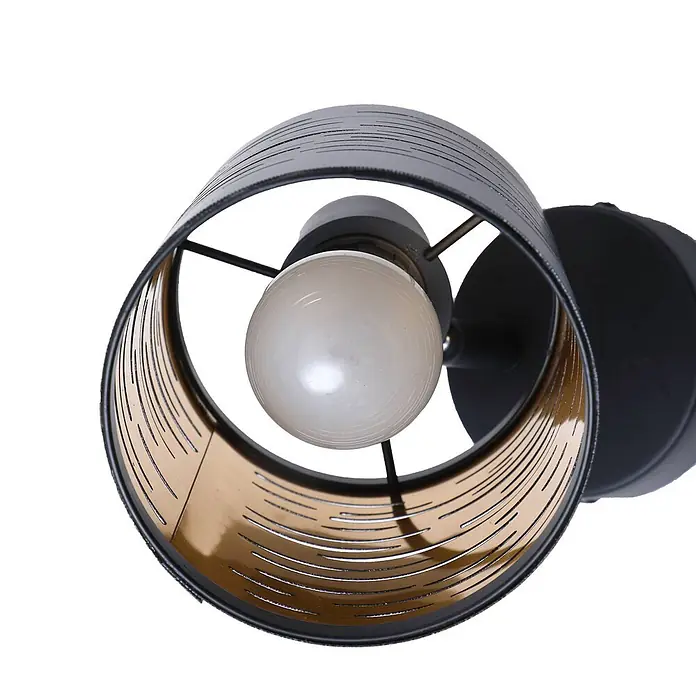 Lindby Wandleuchte Iolyn - schwarz, E14 - Schwarze zylindrische Wandleuchte mit perforiertem Schirm, goldener Innenseite und weißer Glühbirne.