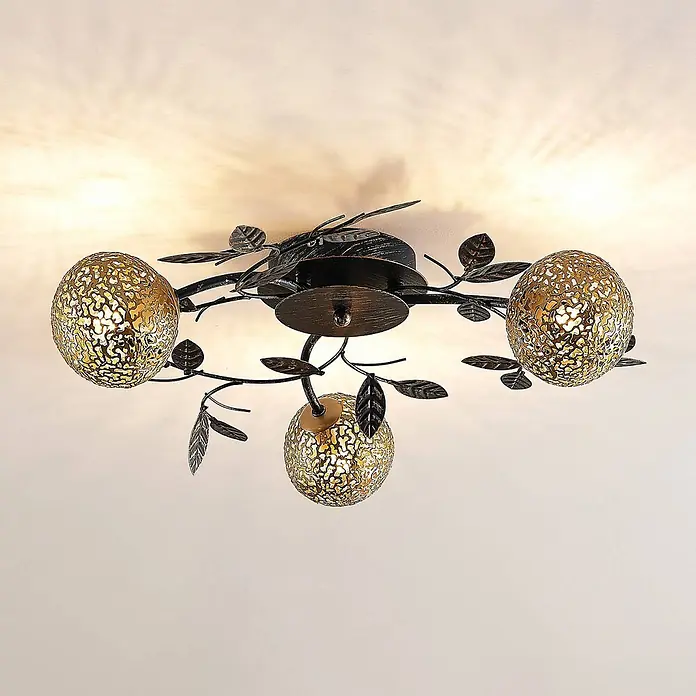 Lucande Deckenleuchte Evory - schwarz, messing / gold, G9 - Dunkle Metall-Deckenleuchte mit Ast-Design und drei goldenen, perforierten Kugeln, die warmes Licht werfen.