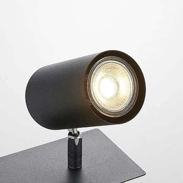 Lindby Deckenstrahler Joffrey - L x B x H: 49 x 9,5 x 16,5 cm, schwarz, schwarz, GU10 - Schwarz-zylindrischer Strahler mit warmweißem Licht auf einer strukturierten dunkelgrauen Basis.
