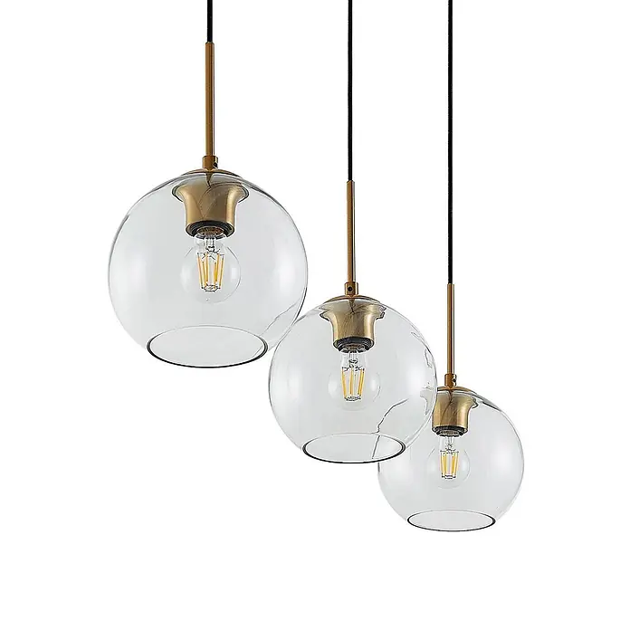 Lindby Pendelleuchte Grady - L x B x H: 110 x 20 x 17,5 cm, klar / transparent, messing, transparent, Schwarz, E27 - Drei moderne Pendelleuchten mit klaren Glaskugeln, messingfarbenen Beschlägen und sichtbaren Filamentlampen.
