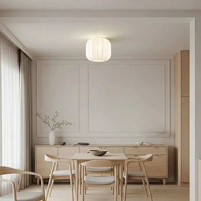 Lindby Deckenleuchte Helin - weiß / opal, E27 - Weiße, gerippte Stoff-Deckenleuchte beleuchtet einen modernen Essbereich.