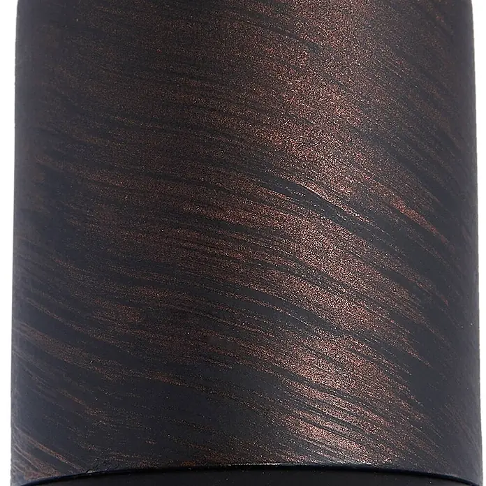 Lindby Deckenleuchte Solm - braun / rost, braun / rost, E14 - Nahaufnahme eines zylindrischen Objekts mit dunkler, gebürsteter Bronzeoberfläche, die metallische Akzente zeigt.