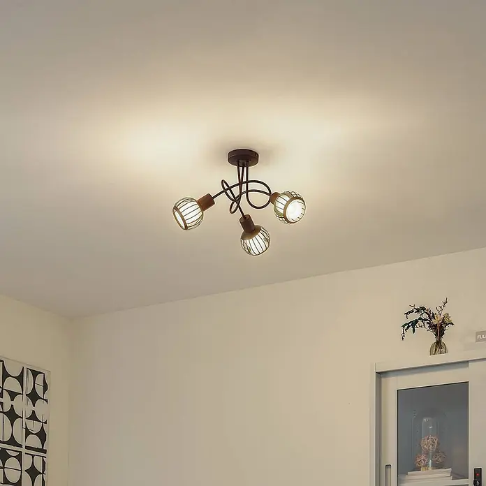 Lindby Deckenleuchte Solm - braun / rost, braun / rost, E14 - Dunkelbraune Deckenleuchte aus Metall mit drei vergitterten Strahlern und Holzapplikationen, die die Decke beleuchtet.